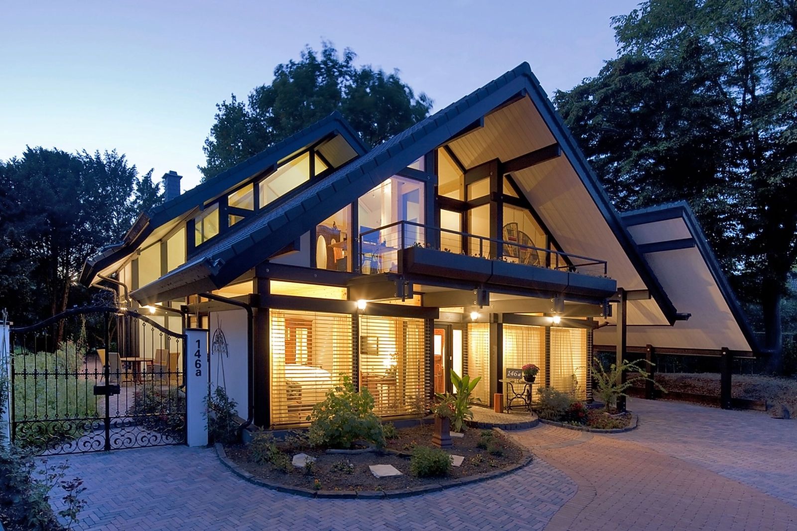 Contemporary home glowing at dusk